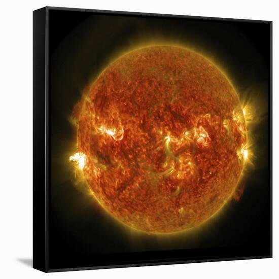 A Solar Flare Erupting on the Left Side of the Sun-null-Framed Stretched Canvas