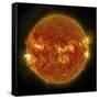 A Solar Flare Erupting on the Left Side of the Sun-null-Framed Stretched Canvas