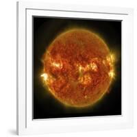 A Solar Flare Erupting on the Left Side of the Sun-null-Framed Art Print