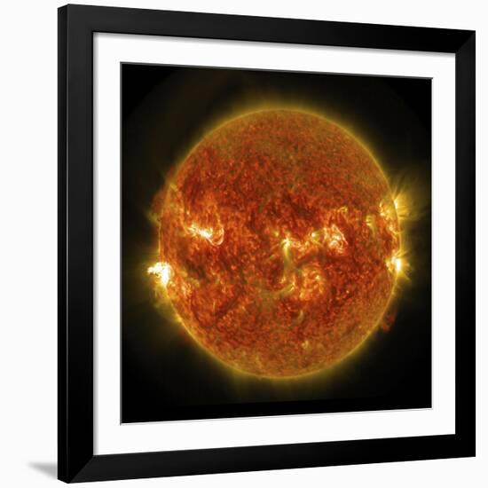 A Solar Flare Erupting on the Left Side of the Sun-null-Framed Art Print