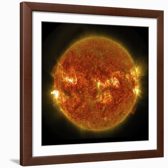 A Solar Flare Erupting on the Left Side of the Sun-null-Framed Art Print