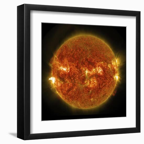 A Solar Flare Erupting on the Left Side of the Sun-null-Framed Art Print