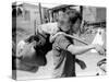 A South Vietnamese Father Carries His Son and a Bag of Household Possessions-null-Stretched Canvas