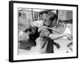 A South Vietnamese Father Carries His Son and a Bag of Household Possessions-null-Framed Photographic Print