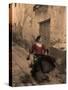 A Spanish Woman Walking Along a Traditional Spanish Street Wearing a Flamenco Style Dress-Steven Boone-Stretched Canvas