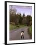 A Spring Lamb Walks in the Scenic Glens of Antrim in Cushendall, Northern Ireland-null-Framed Premium Photographic Print