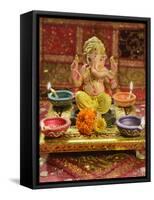 A Statue of a Mythological Elephant God -Ganesha, Surrounded by Traditional Divali Lamps-satel-Framed Stretched Canvas