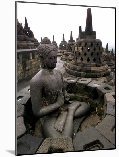 A Statue of Buddha Sits on a Terrace-Dita Alangkara-Mounted Photographic Print