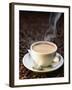 A Steaming Cup of Coffee on Coffee Beans-Peter Sapper-Framed Photographic Print