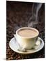 A Steaming Cup of Coffee on Coffee Beans-Peter Sapper-Mounted Photographic Print