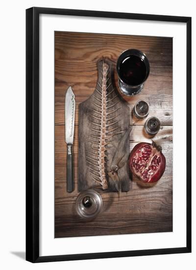 A Still Life Featuring a Fish Skeleton, Pomegranate and Red Wine-Komar-Framed Photographic Print