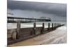 A stormy sky over the beach and pier at Cromer, Norfolk, England, United Kingdom, Europe-Jon Gibbs-Mounted Photographic Print