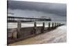 A stormy sky over the beach and pier at Cromer, Norfolk, England, United Kingdom, Europe-Jon Gibbs-Stretched Canvas