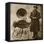 A Street Hawker Entertains with a Gramophone, Transported in a Pram-null-Framed Stretched Canvas