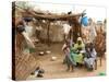 A Sudanese Family is Seen Inside Their Thatched Hut During the Visit of Unicef Goodwill Ambassador-null-Stretched Canvas