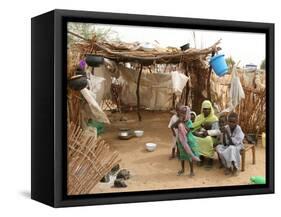 A Sudanese Family is Seen Inside Their Thatched Hut During the Visit of Unicef Goodwill Ambassador-null-Framed Stretched Canvas