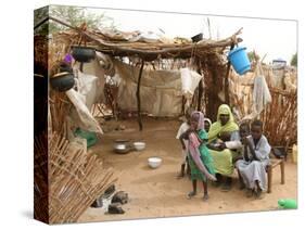 A Sudanese Family is Seen Inside Their Thatched Hut During the Visit of Unicef Goodwill Ambassador-null-Stretched Canvas