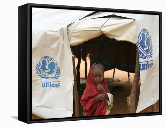 A Sudanese School Girl Stands Infront of Her Class Room-null-Framed Stretched Canvas