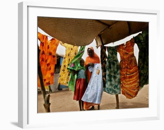 A Sudanese Woman Buys a Dress for Her Daughter at the Zamzam Refugee Camp-null-Framed Photographic Print