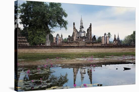 A Sukhothai Era Buddha at Wat Mahathat, Sukhothai Historical Park, Thailand-Alex Robinson-Stretched Canvas