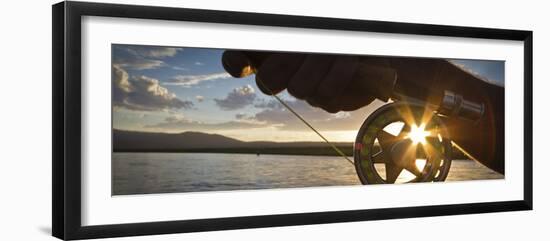 A Sunset Sunstart Through the Fly Reel of an Angler on the Henry's Fork River in Idaho.-Clint Losee-Framed Photographic Print