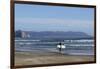 A surfer approaches the water, Morro Rock in the background. San Luis Obispo County, California, Us-Susan Pease-Framed Photographic Print