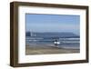 A surfer approaches the water, Morro Rock in the background. San Luis Obispo County, California, Us-Susan Pease-Framed Photographic Print