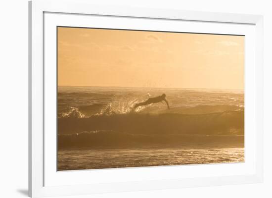 A Surfer Dives over a Wave on Praia Da Joaquina Beach on Florianopolis Island-Alex Saberi-Framed Photographic Print