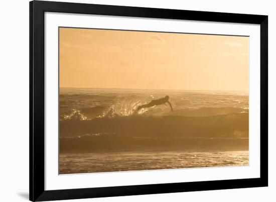 A Surfer Dives over a Wave on Praia Da Joaquina Beach on Florianopolis Island-Alex Saberi-Framed Photographic Print