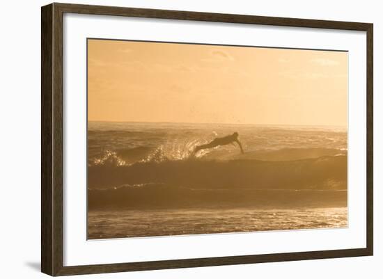 A Surfer Dives over a Wave on Praia Da Joaquina Beach on Florianopolis Island-Alex Saberi-Framed Photographic Print