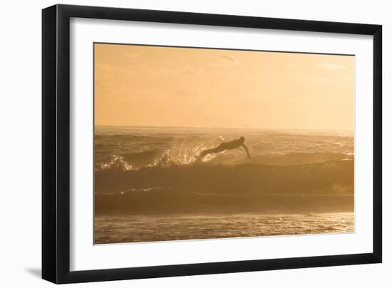 A Surfer Dives over a Wave on Praia Da Joaquina Beach on Florianopolis Island-Alex Saberi-Framed Photographic Print