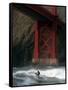 A Surfer is Dwarfed by the Northern End of the Golden Gate Bridge While Riding the Waves-null-Framed Stretched Canvas