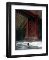 A Surfer is Dwarfed by the Northern End of the Golden Gate Bridge While Riding the Waves-null-Framed Photographic Print