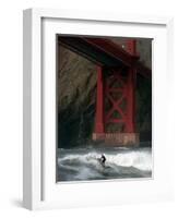 A Surfer is Dwarfed by the Northern End of the Golden Gate Bridge While Riding the Waves-null-Framed Photographic Print