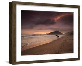 A Surfer Makes His Way Out of the Water at Praia Itamambuca in Ubatuba, Brazil-Alex Saberi-Framed Photographic Print