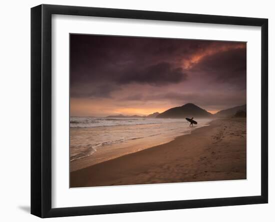 A Surfer Makes His Way Out of the Water at Praia Itamambuca in Ubatuba, Brazil-Alex Saberi-Framed Photographic Print