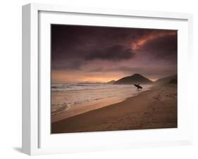 A Surfer Makes His Way Out of the Water at Praia Itamambuca in Ubatuba, Brazil-Alex Saberi-Framed Photographic Print