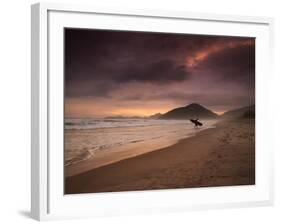 A Surfer Makes His Way Out of the Water at Praia Itamambuca in Ubatuba, Brazil-Alex Saberi-Framed Photographic Print