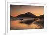 A Surfer Makes His Way Out of the Water at Sunset on Praia Do Itamambuca in Brazil-Alex Saberi-Framed Photographic Print