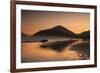 A Surfer Makes His Way Out of the Water at Sunset on Praia Do Itamambuca in Brazil-Alex Saberi-Framed Photographic Print