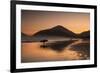 A Surfer Makes His Way Out of the Water at Sunset on Praia Do Itamambuca in Brazil-Alex Saberi-Framed Photographic Print