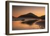 A Surfer Makes His Way Out of the Water at Sunset on Praia Do Itamambuca in Brazil-Alex Saberi-Framed Photographic Print