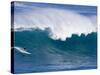 A Surfer Rides a Wave at Waimea Beach-null-Stretched Canvas