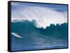 A Surfer Rides a Wave at Waimea Beach-null-Framed Stretched Canvas