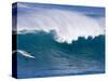 A Surfer Rides a Wave at Waimea Beach-null-Stretched Canvas