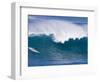 A Surfer Rides a Wave at Waimea Beach-null-Framed Photographic Print