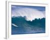 A Surfer Rides a Wave at Waimea Beach-null-Framed Photographic Print