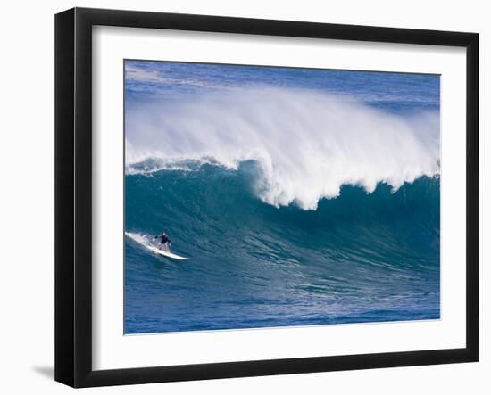 A Surfer Rides a Wave at Waimea Beach-null-Framed Photographic Print