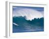 A Surfer Rides a Wave at Waimea Beach-null-Framed Photographic Print