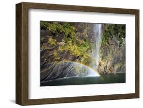 A Tall Waterfall Drops Off a Steep Cliff into Waters, Milford Sound on South Island, New Zealand-Paul Dymond-Framed Photographic Print